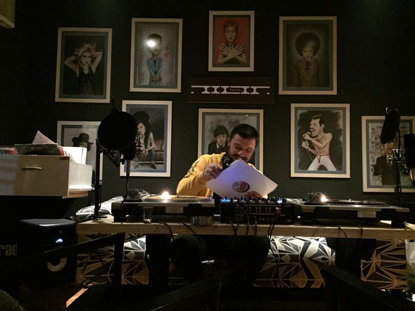 Yll Megi selecting vinyl in the booth